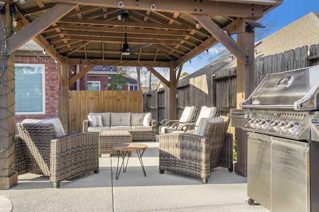 view of patio / terrace featuring a gazebo, grilling area, outdoor lounge area, and ceiling fan