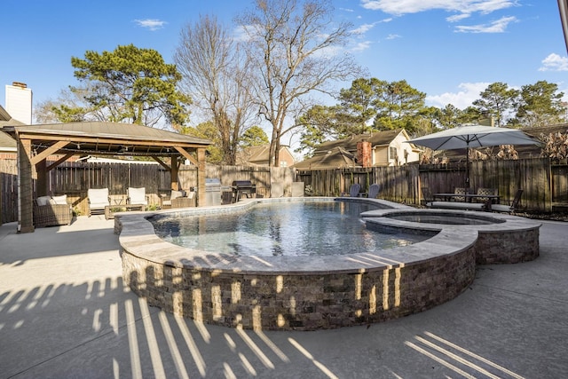 view of pool with a gazebo, area for grilling, an in ground hot tub, and a patio