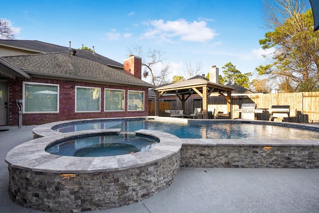 view of pool featuring an in ground hot tub, area for grilling, a gazebo, and a patio area