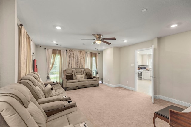 carpeted living room featuring ceiling fan