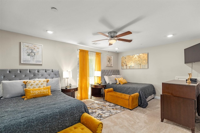 bedroom with light colored carpet and ceiling fan