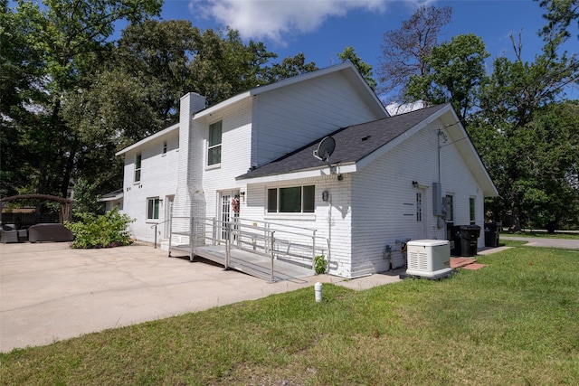 exterior space featuring a yard and a patio