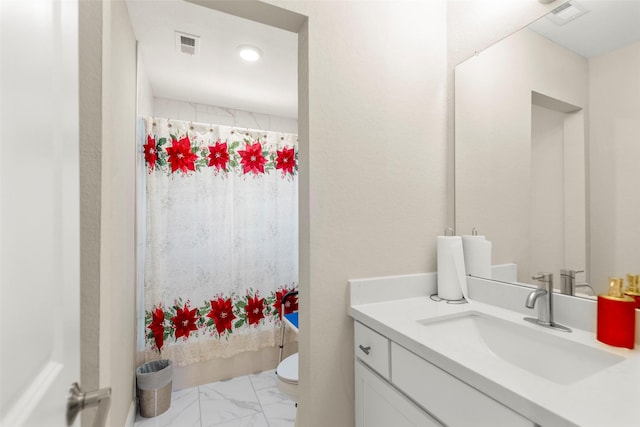 bathroom featuring vanity, a shower with curtain, and toilet