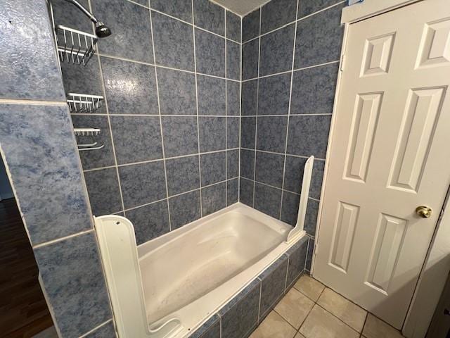 bathroom with tile patterned flooring and tiled shower / bath combo