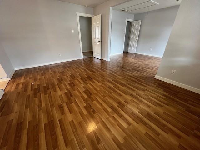 spare room featuring dark hardwood / wood-style flooring