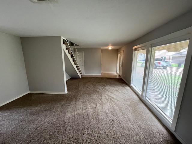 unfurnished room with carpet floors