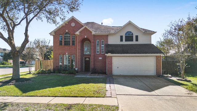 view of property featuring a garage and a front yard