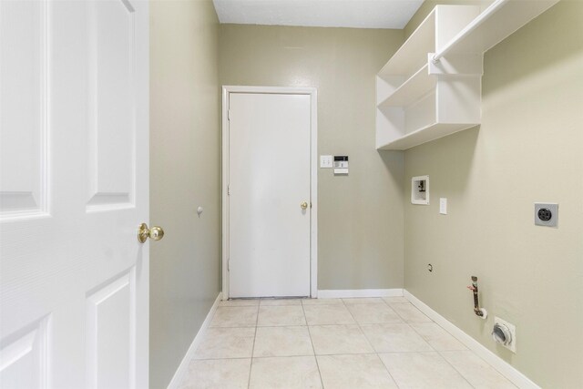 laundry area with washer hookup, light tile patterned floors, hookup for a gas dryer, and hookup for an electric dryer