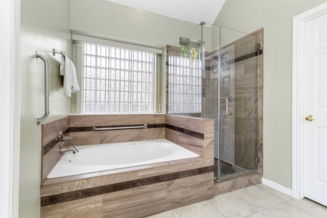 bathroom with tile patterned floors and independent shower and bath