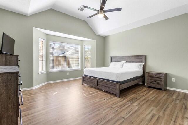 unfurnished bedroom featuring lofted ceiling, light hardwood / wood-style floors, and ceiling fan