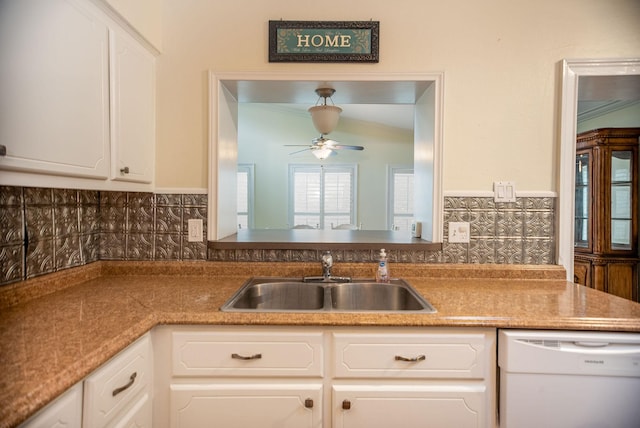 kitchen with sink, white cabinets, and dishwasher