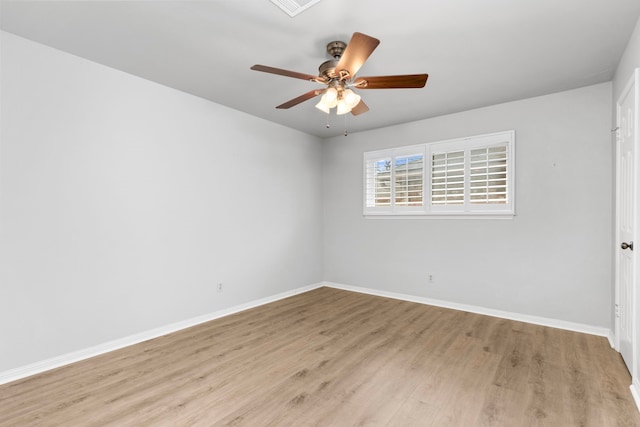 unfurnished room featuring light hardwood / wood-style floors and ceiling fan