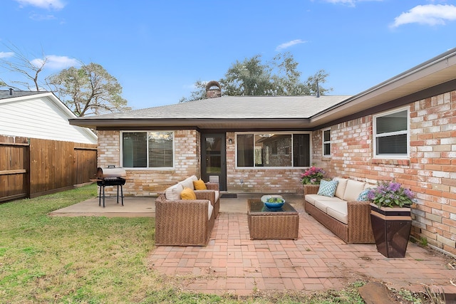 rear view of property with a patio, an outdoor hangout area, and a lawn