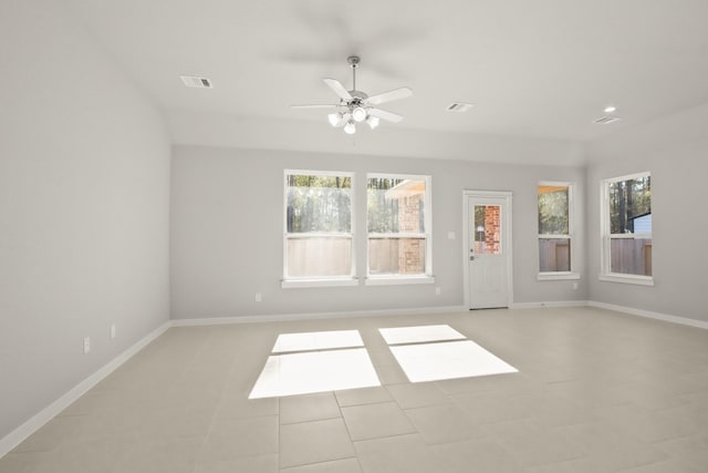 unfurnished room featuring ceiling fan and light tile patterned floors