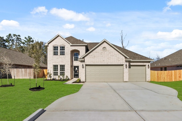 view of front of home with a garage and a front lawn