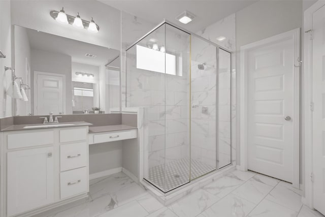 bathroom with vanity and a shower with shower door