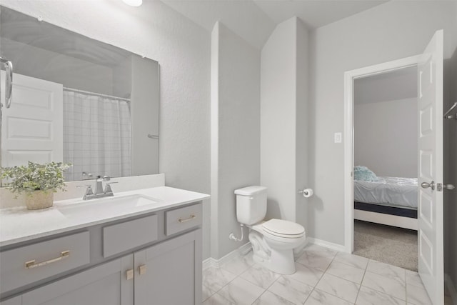 bathroom with vanity, a shower with shower curtain, and toilet