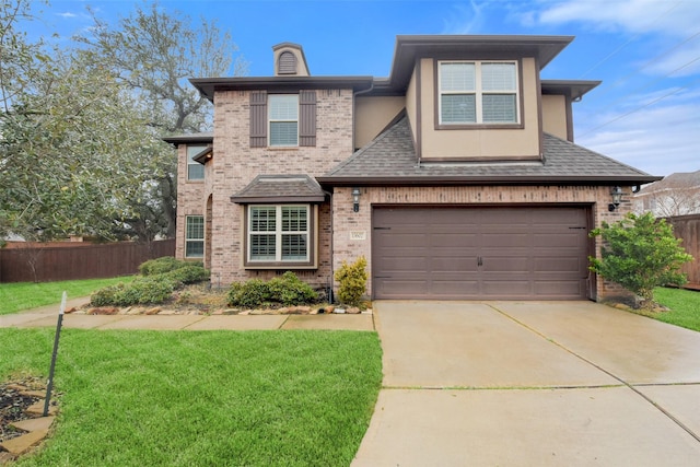 view of front facade with a garage and a front yard