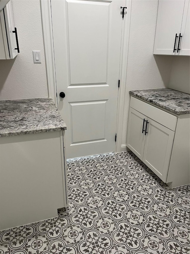 laundry room with light tile patterned floors