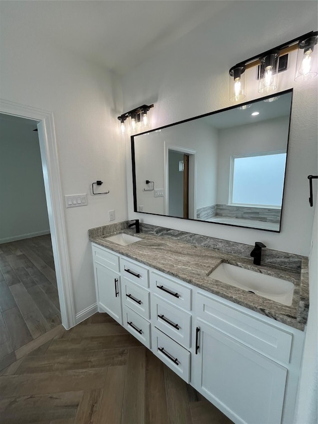 bathroom with vanity and wood-type flooring