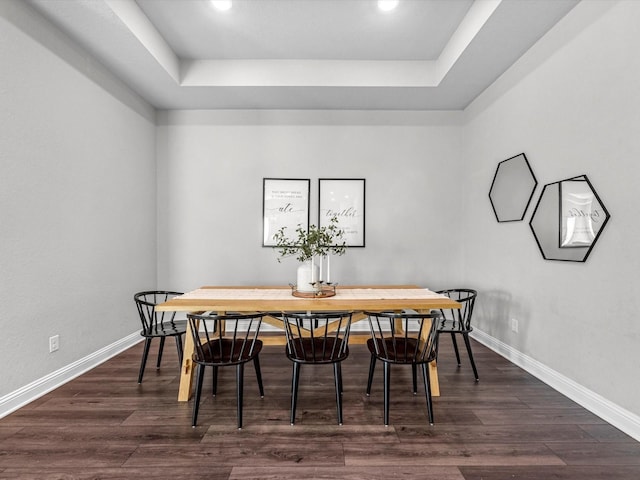 dining area with dark hardwood / wood-style floors