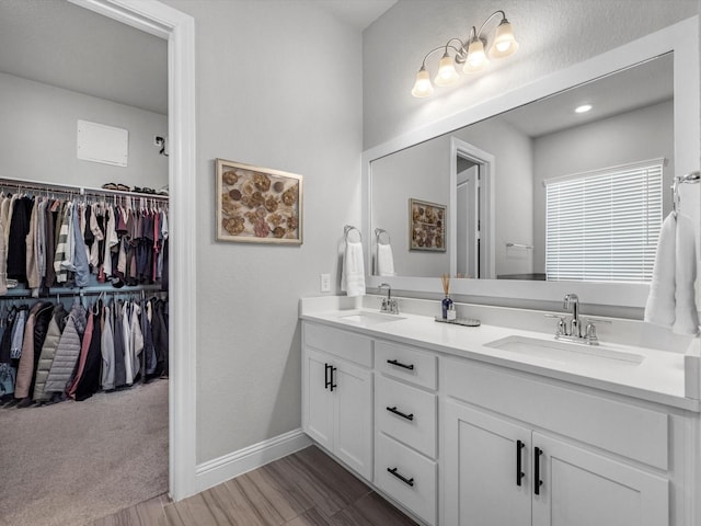 bathroom featuring vanity and hardwood / wood-style floors