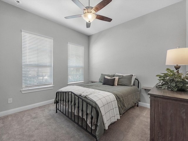 bedroom with light colored carpet and ceiling fan