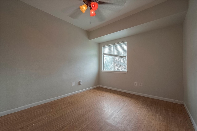 empty room featuring hardwood / wood-style flooring and ceiling fan