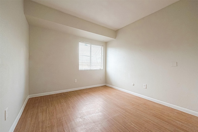 spare room featuring hardwood / wood-style flooring