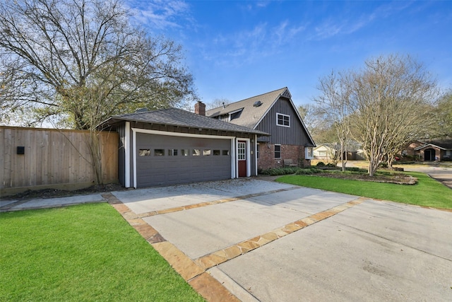 view of front of property with a garage and a front lawn