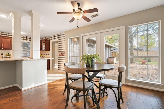 dining room featuring hardwood / wood-style flooring, ceiling fan, and french doors