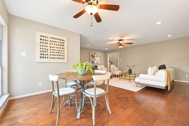 dining space featuring hardwood / wood-style flooring and ceiling fan