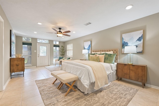 bedroom featuring ceiling fan, access to exterior, and light tile patterned floors