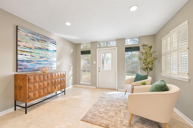 foyer featuring light tile patterned floors