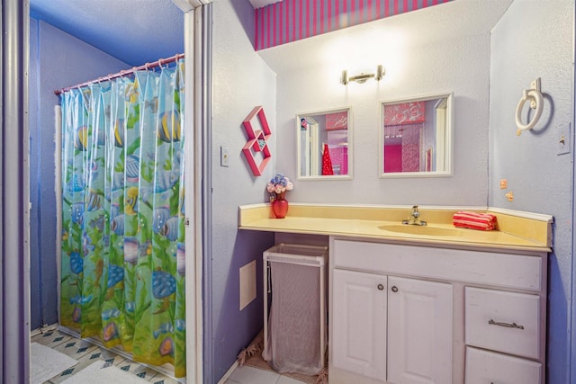 bathroom with vanity, a shower with curtain, and tile patterned floors