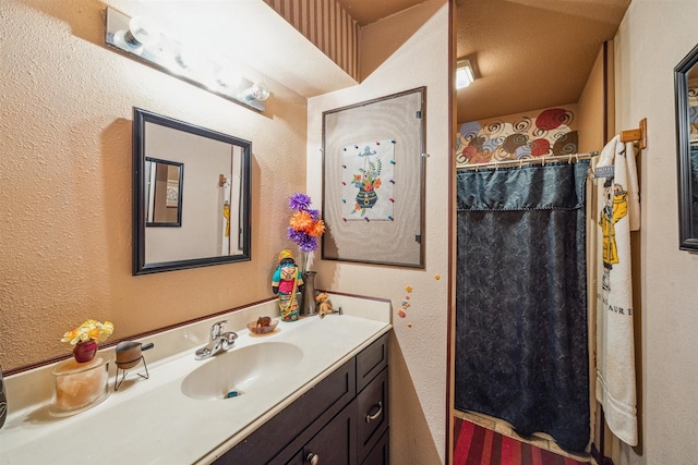 bathroom featuring vanity and walk in shower