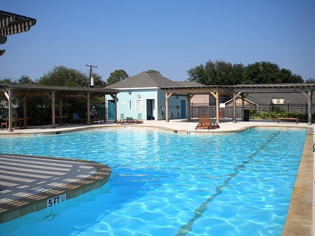 view of swimming pool with a pergola and a patio area