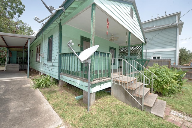 exterior space with ceiling fan