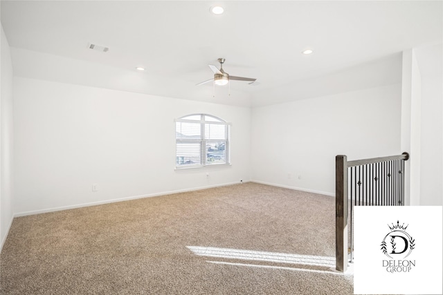 unfurnished room with carpet floors and ceiling fan