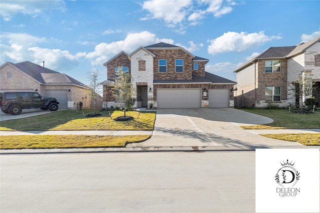 view of front of property with a garage and a front lawn