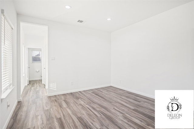 unfurnished room featuring light hardwood / wood-style floors