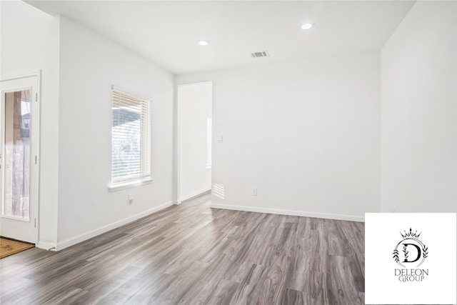 empty room with wood-type flooring