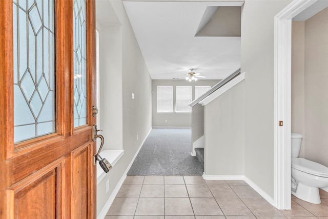 tiled entrance foyer with ceiling fan