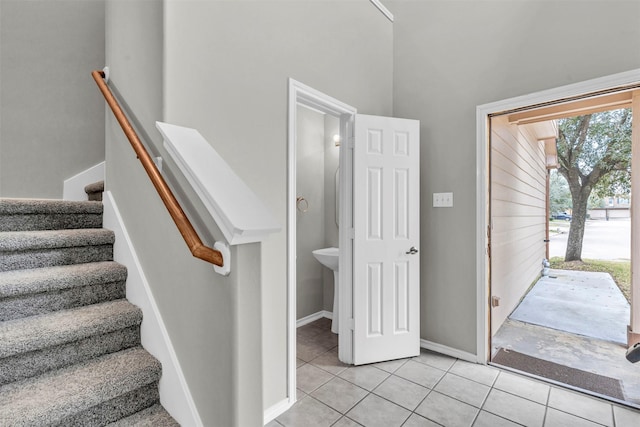 staircase with tile patterned floors