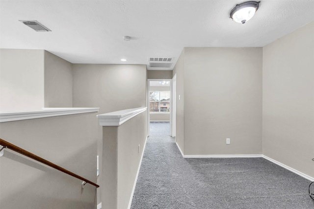 hallway with carpet floors