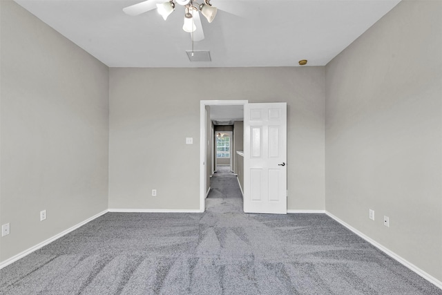 spare room with carpet and ceiling fan