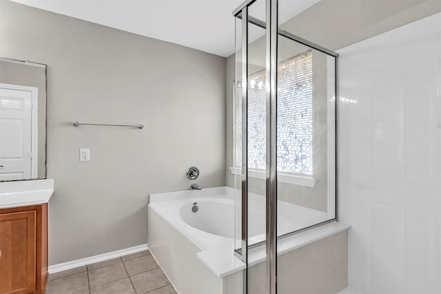 bathroom with vanity, tile patterned floors, and independent shower and bath