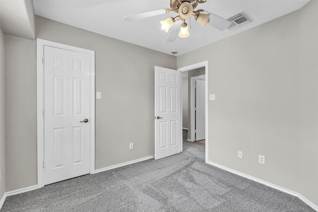 unfurnished bedroom with ceiling fan and carpet flooring