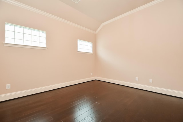 unfurnished room with hardwood / wood-style floors, vaulted ceiling, and ornamental molding