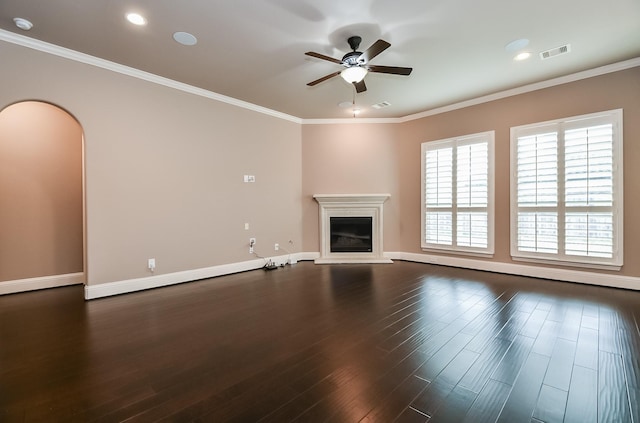 unfurnished living room featuring ceiling fan, ornamental molding, and dark hardwood / wood-style floors